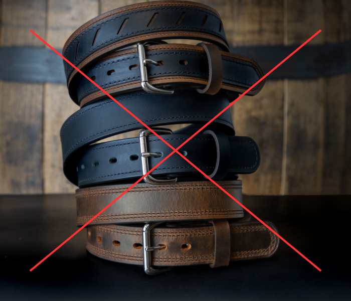 Heavy looking leather belts with a big red X through the image. Showcasing that the best hiking belts are not leather and are lightweight.