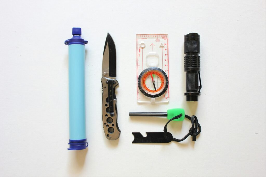 An emergency water filter, pocket knife, flashlight and compass.