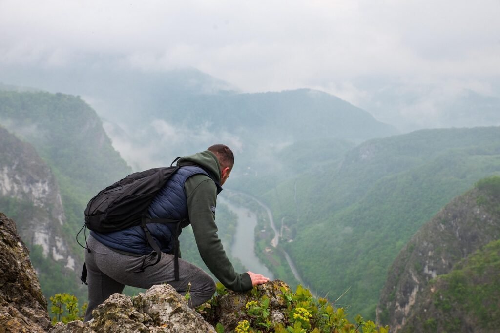A lone day hiker on a mountain. How to train for your first day hike.